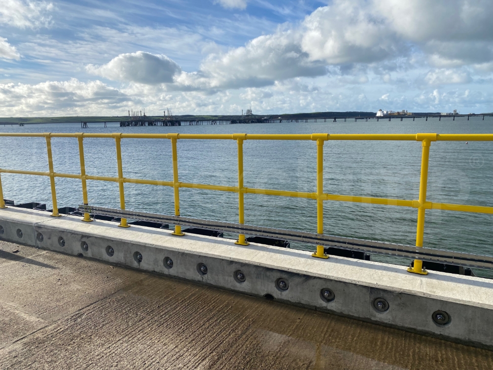 Interclamp key clamp fittings used to construct a double rail barrier on a busy jetty. The fittings and tube were also powder coated in safety yellow to enhance durability and visibility.